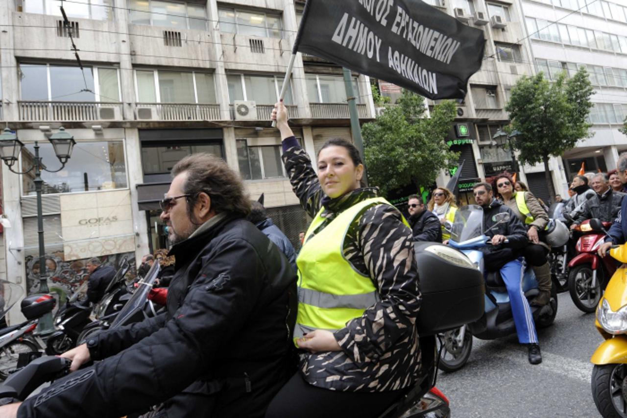 'Local government employees and members of the union POE-OTA and ADEDY arrive for a protest action in front of the Ministry of Administrative Reform in Athens, Greece, 30 November 2012. Photo: Giorgos