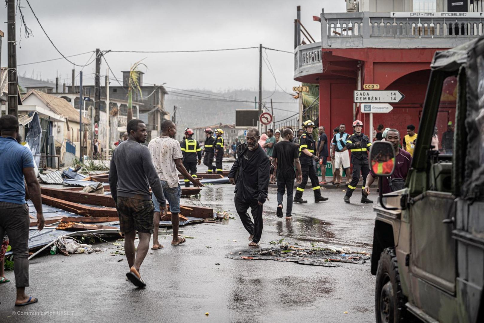 Residents walk near rescue workers in storm-hit Mayotte, France, in this handout image obtained by Reuters on December 16, 2024. UIISC7/Securite Civile/Handout via REUTERS    THIS IMAGE HAS BEEN SUPPLIED BY A THIRD PARTY. NO RESALES. NO ARCHIVES Photo: UIISC7/Securite Civile/REUTERS