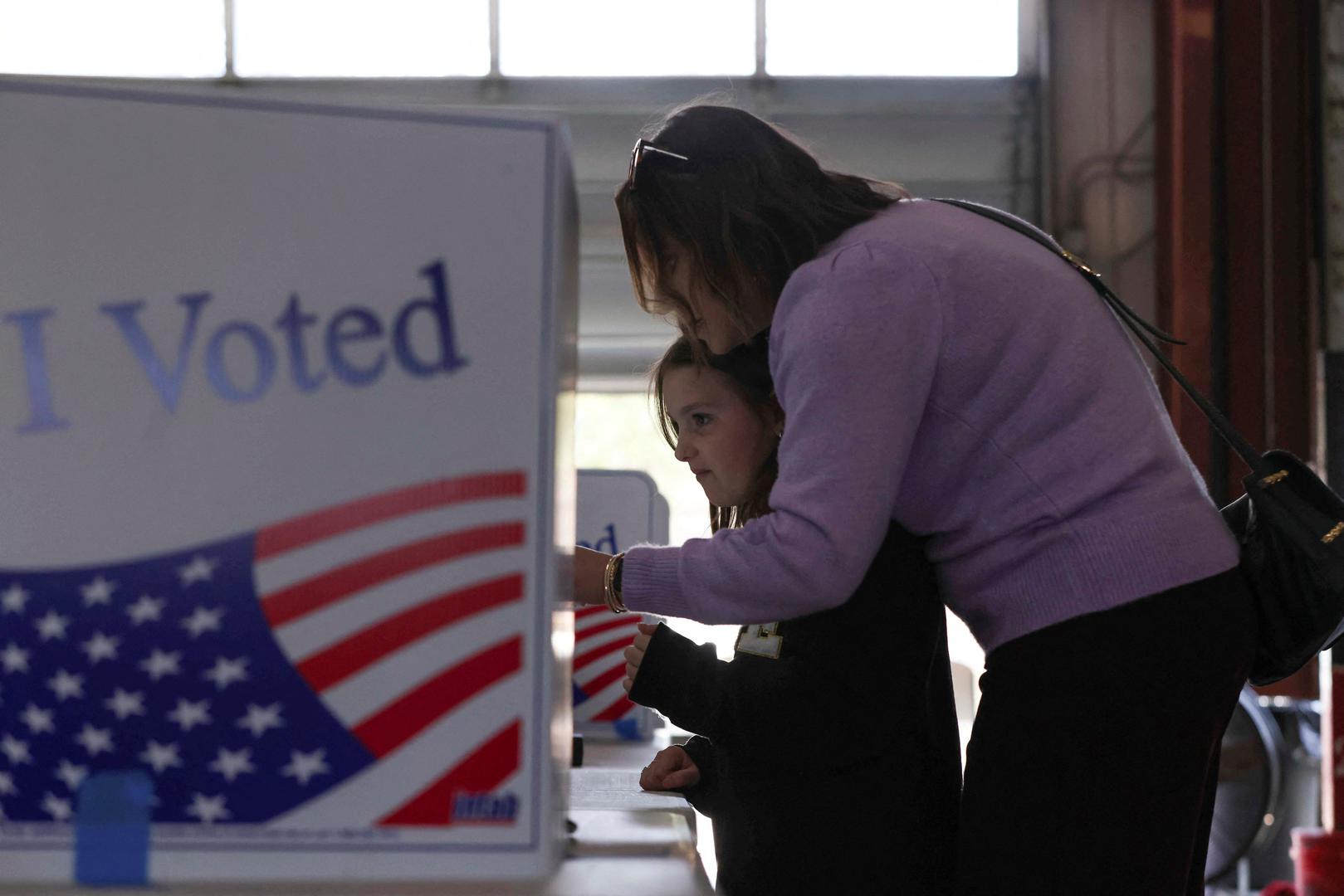 Piper Gallery watches her mother, English Gallery, cast her vote for Republican presidential candidate and former U.S. Ambassador to the United Nations Nikki Haley at the Northlake Fire Station during the Republican presidential primary election on Election Day, in Irmo, South Carolina, U.S. February 24, 2024. REUTERS/Alyssa Pointer Photo: Alyssa Pointer/REUTERS