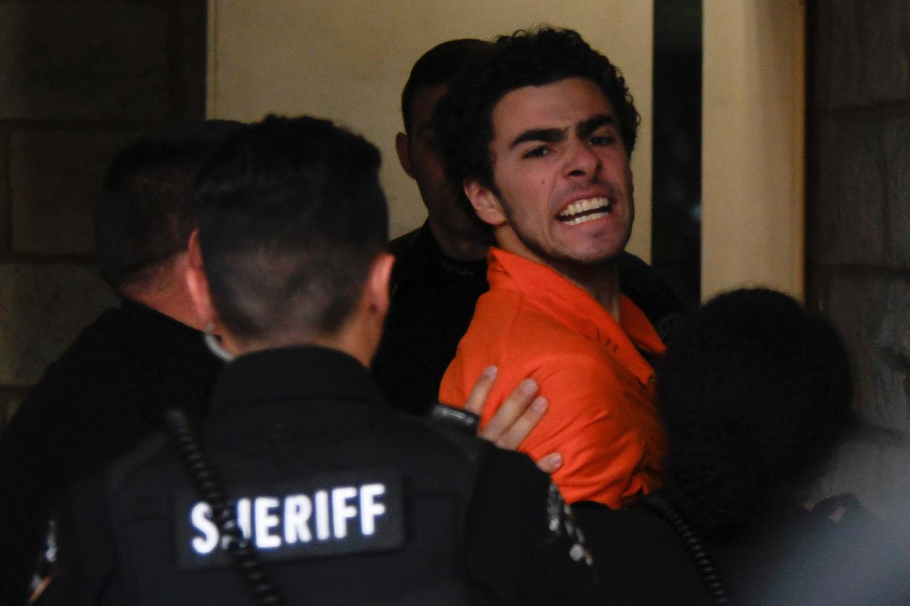 Luigi Mangione arrives for an extradition hearing at Blair County Court House in Hollidaysburg, Pennsylvania