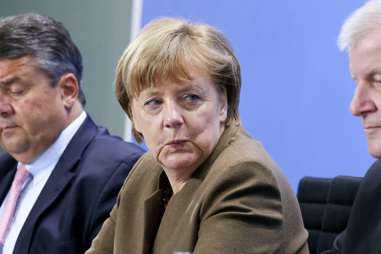 German Minister of Economic Affairs and Vice Chancellor Sigmar Gabriel (L-R), German Chancellor Angela Merkel and CSU Chairman Horst Seehofer present the results of last night's coalition summit at a press conference in the Chancellery in Berlin,?Germany,