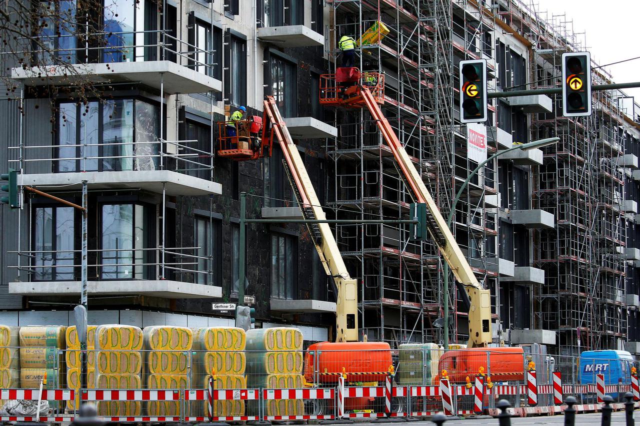 FILE PHOTO: Workers are seen at a construction site for a residential building, in Berlin