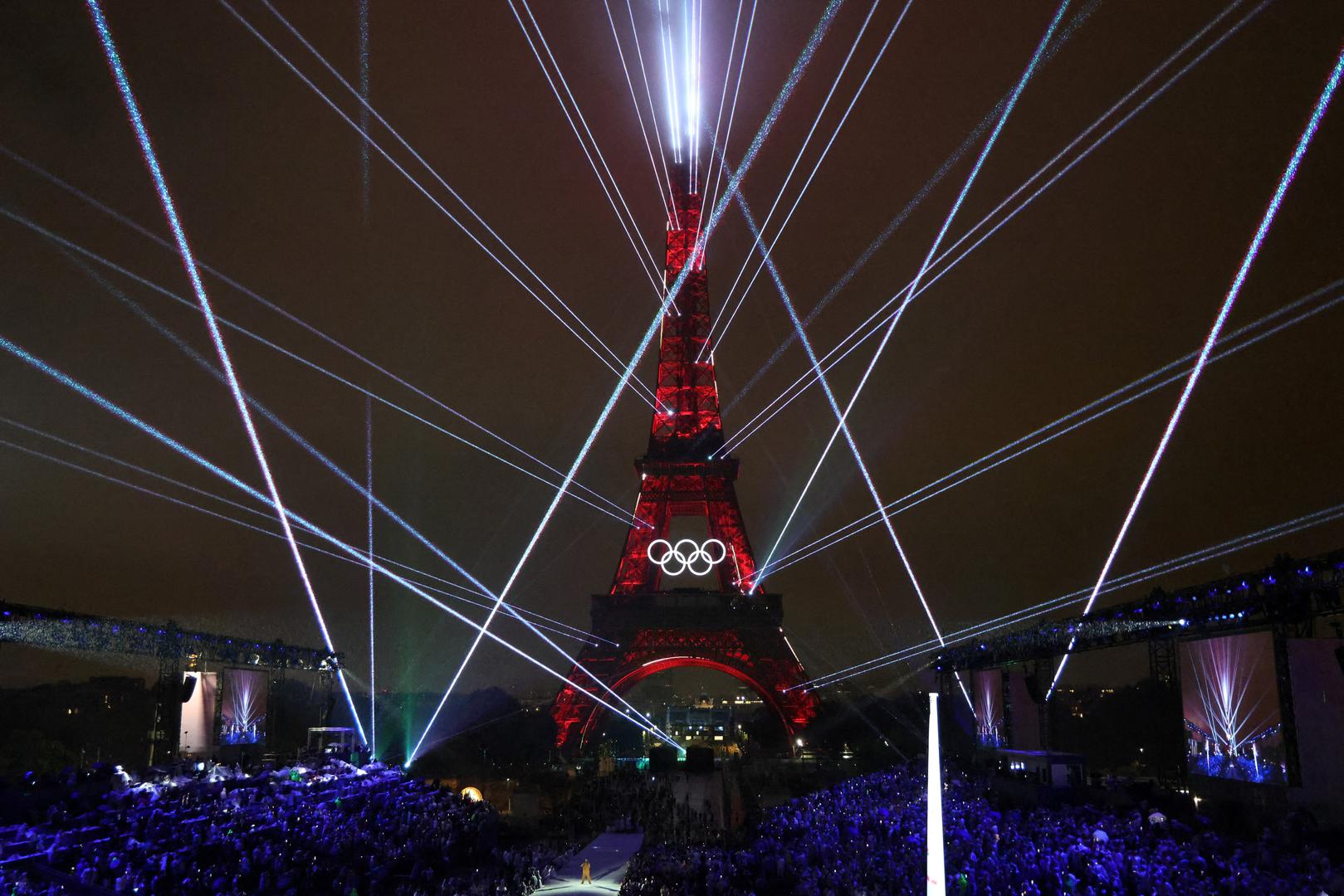 Paris 2024 Olympics - Opening Ceremony - Paris, France - July 26, 2024. Lights illuminate the Eiffel Tower during the opening ceremony of the Paris 2024 Olympic Games.     LUDOVIC MARIN/Pool via REUTERS Photo: LUDOVIC MARIN/REUTERS