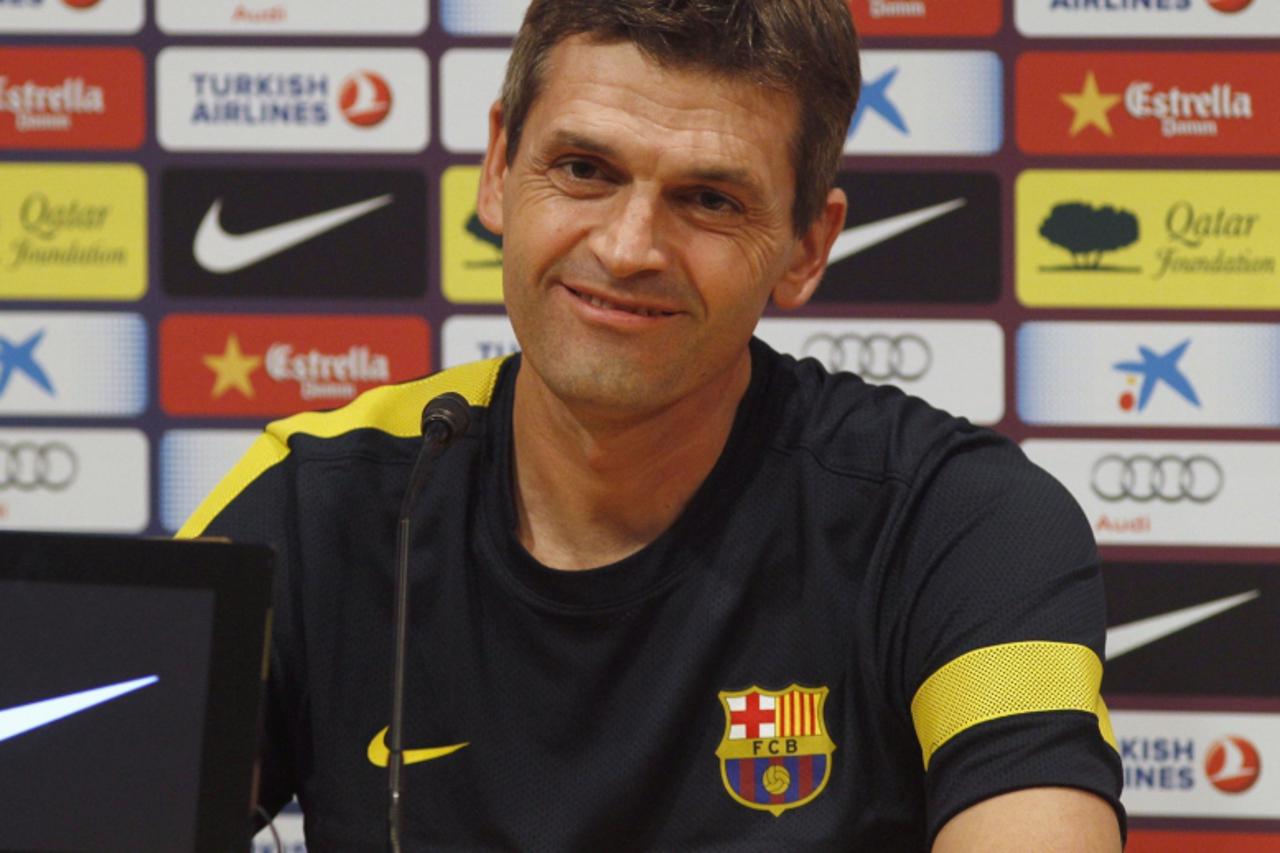 'Barcelona's coach Tito Vilanova smiles during a news conference ahead of his team's Spanish first division soccer match of the season against Real Madrid at Nou Camp stadium, in Barcelona, October 