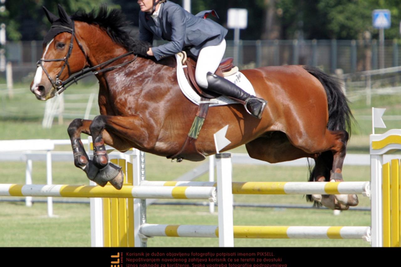 '13.06.2010., Zagreb -  Hipodrom Zagreb.Medjunarodni lipanjski turnir-Kat:A 18 Pehar Grada Zagreba. Janka Krasovec Konjicki klub Purgerski s konjem Cabano. Photo: Robert Anic/PIXSELL'