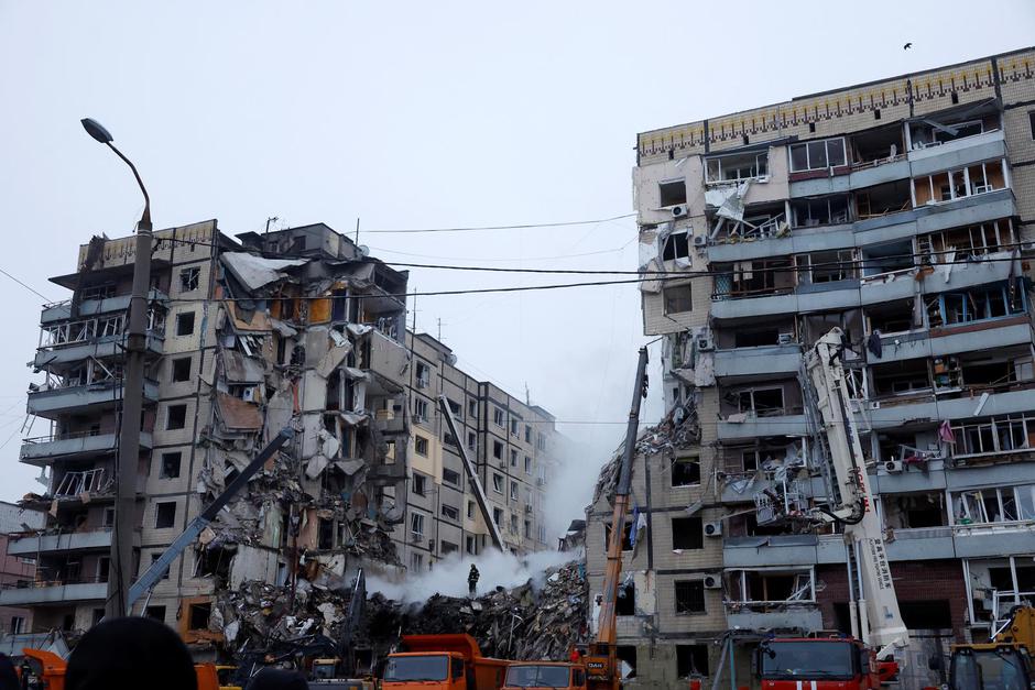 Aftermath of Dnipro apartment block destruction following missile strike