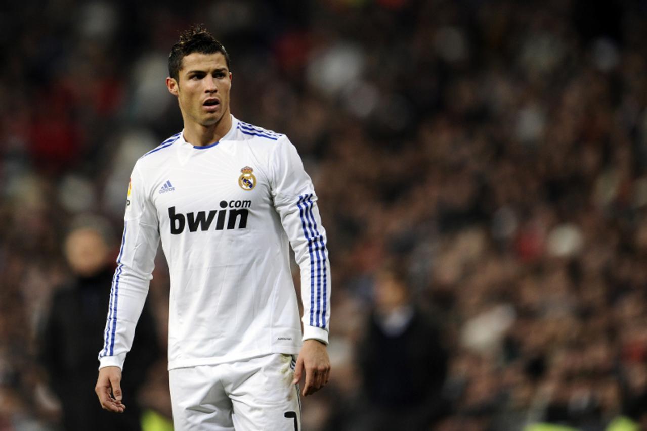 'Real Madrid\'s Portuguese forward Cristiano Ronaldo looks on during the Spanish League football match between Real Madrid and Mallorca at Santiago Bernabeu stadium in Madrid on January 23, 2011. AFP 