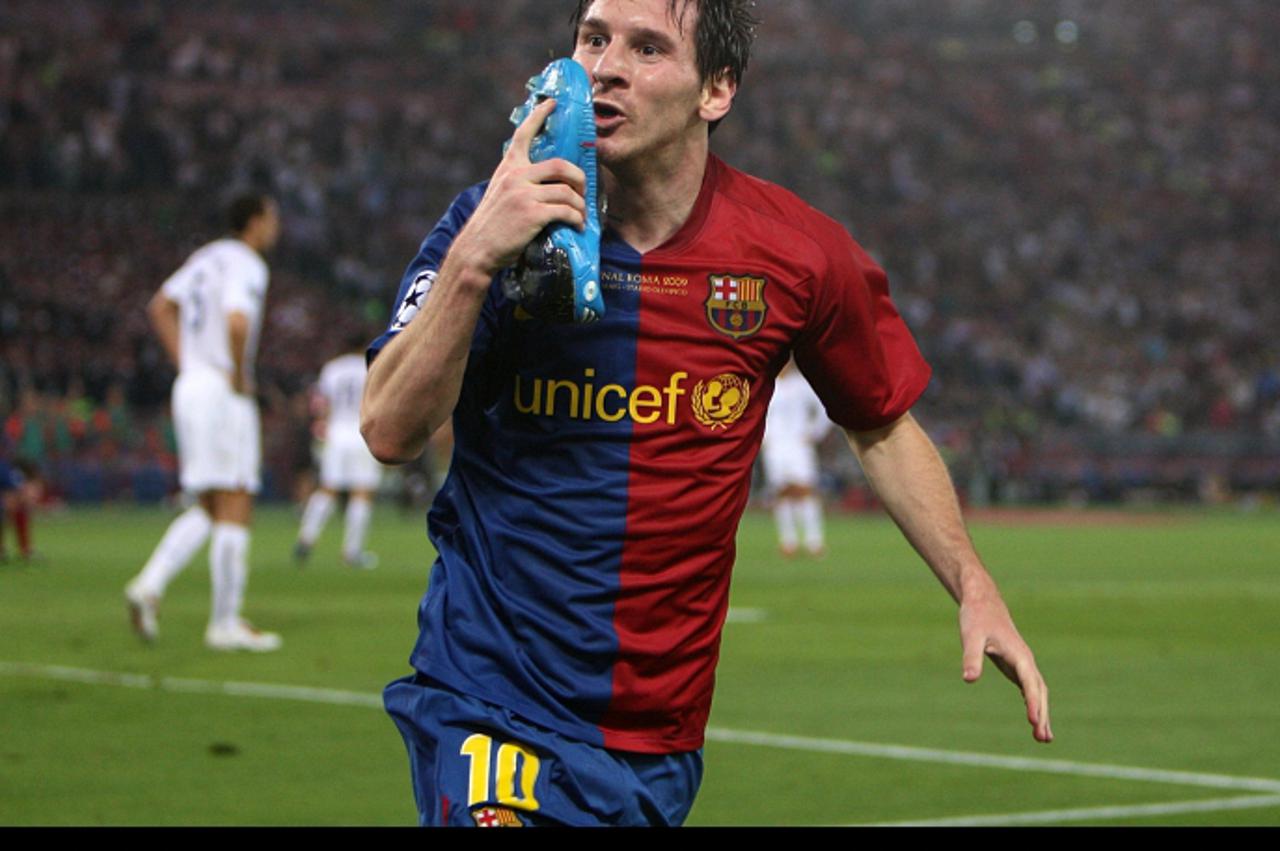 'Barcelona\'s Leo Messi celebrates by kissing his boot after he heads home his sides second goal of the game Photo: Press Association/Pixsell'