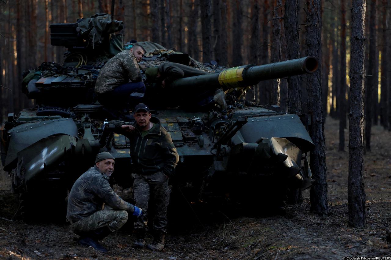 Ukrainian soldier makes repair to tanks, in Kupiansk region