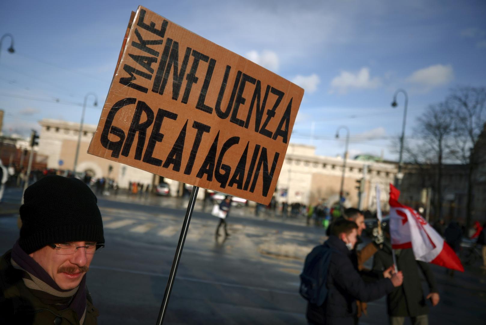 Demonstration against the COVID-19 measures and their economic consequences, in Vienna A protester holds a placard during a demonstration against the coronavirus disease (COVID-19) measures and their economic consequences in Vienna, Austria, January 16, 2021. REUTERS/Lisi Niesner LISI NIESNER