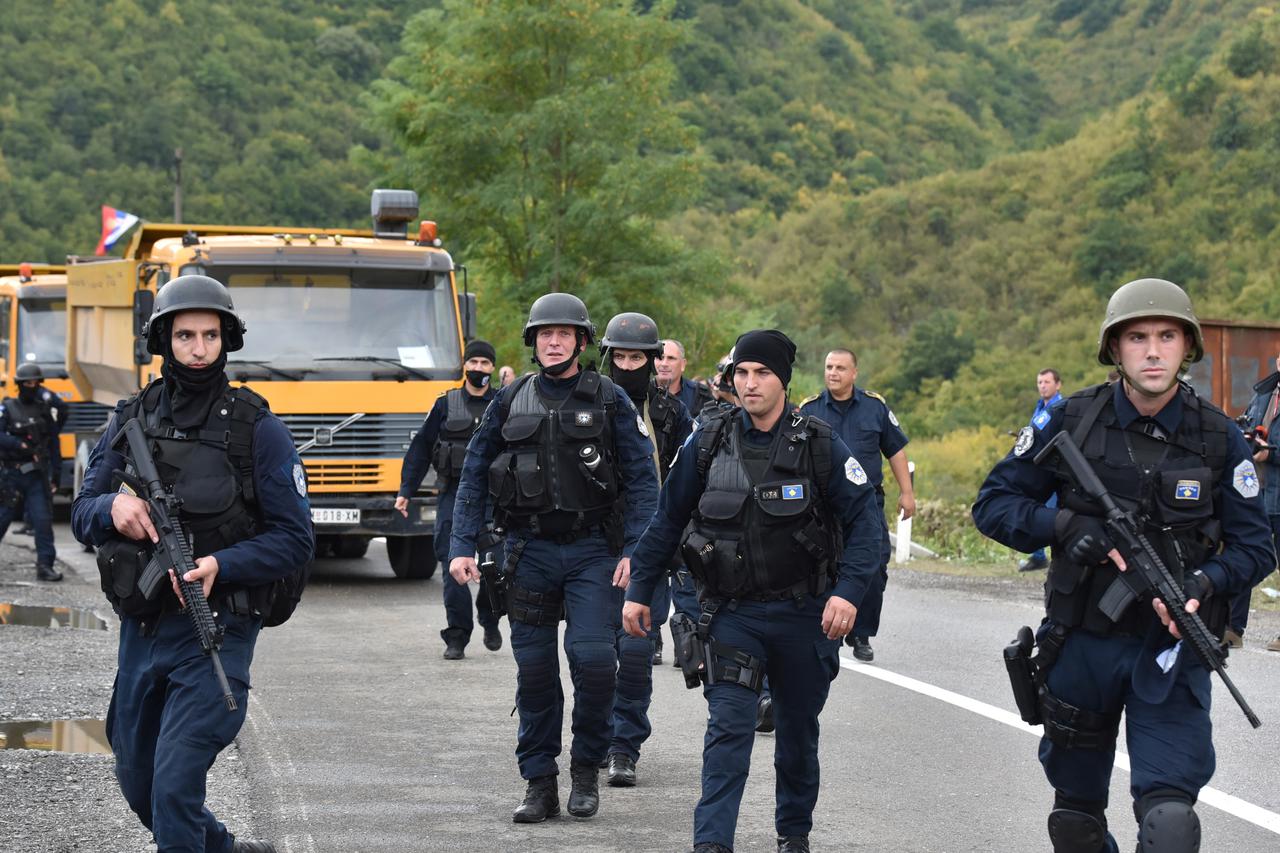 Kosovo special police with armoured vehicles are pictured as hundreds of Kosovo Serbs protest against a government ban on entry of vehicles with Serbian registration plates in Jarinje