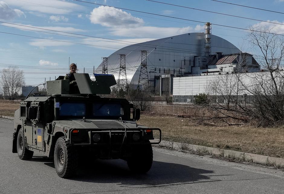 Servicemen of Ukrainian National Guard patrol area near the Chernobyl Nuclear Power Plant, in Chernobyl