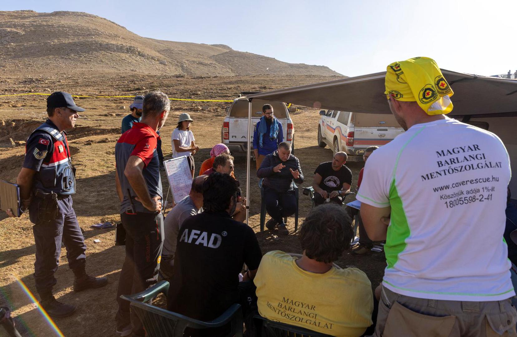 Rescuers hold a meeting near the Morca Cave as a rescue operation continue to reach U.S. caver Mark Dickey who fell ill and became trapped some 1,000 meters (3,280 ft) underground, near Anamur in Mersin province, southern Turkey September 8, 2023. REUTERS/Umit Bektas Photo: UMIT BEKTAS/REUTERS