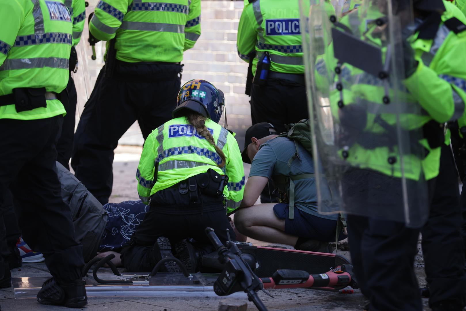 Police and medics attend to a person during a protest in Liverpool, following the stabbing attacks on Monday in Southport, in which three young children were killed. Picture date: Saturday August 3, 2024. Photo: James Speakman/PRESS ASSOCIATION