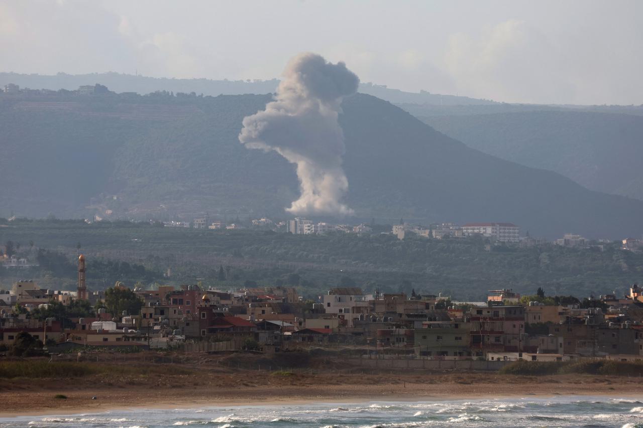 Smoke rises on the Lebanese side of the border with Israel, as seen from Tyre