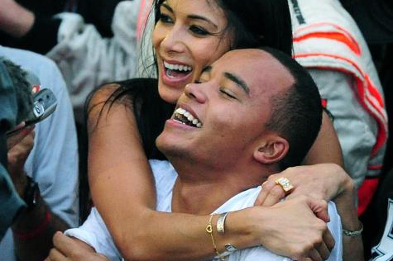 'Lewis Hamilton\'s brother Nick (front) and Girlfriend Nicole Scherzinger celebrate following the Brazilian Grand Prix at InterlagosPhoto: Press Association/PIXSELL'