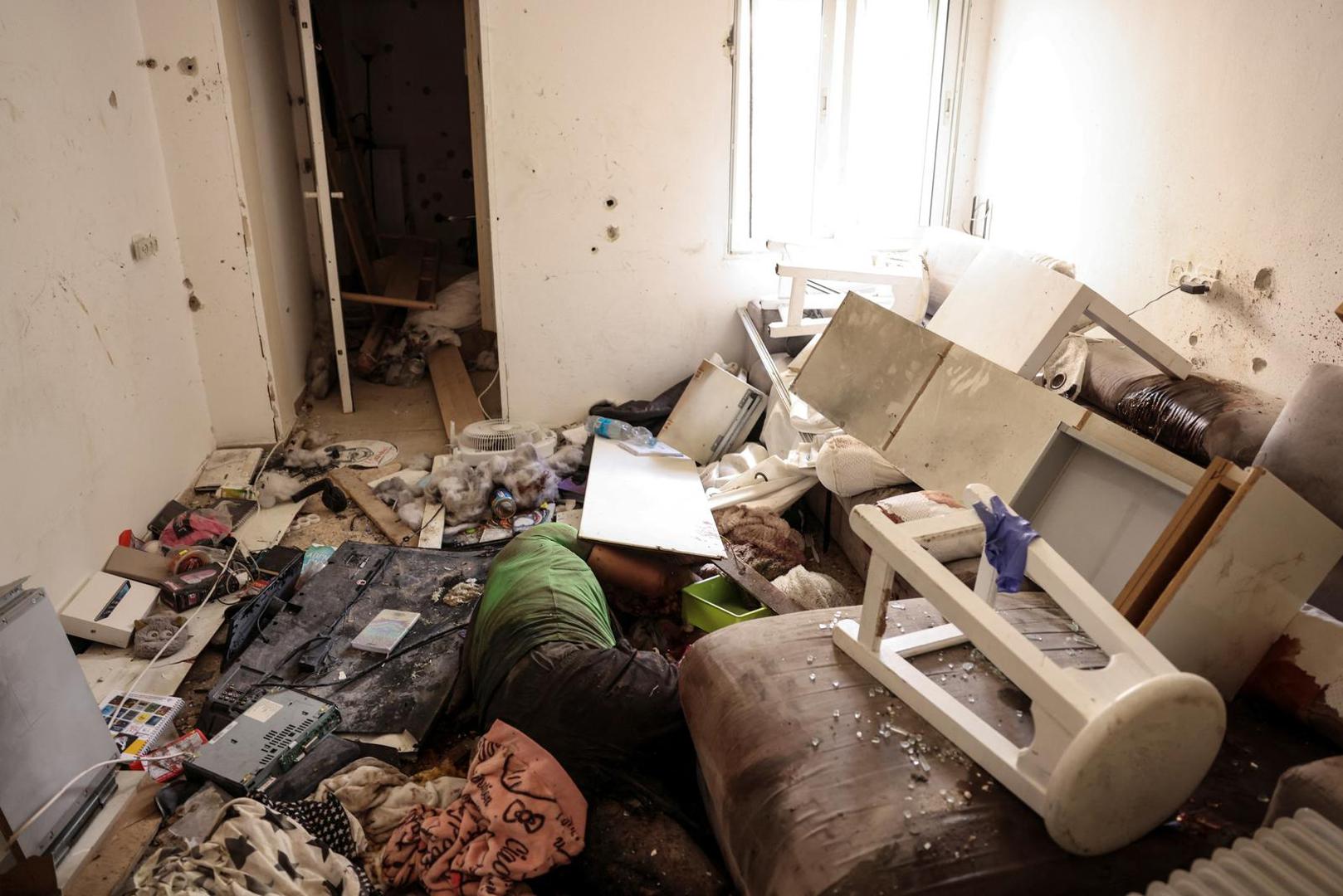 SENSITIVE MATERIAL. THIS IMAGE MAY OFFEND OR DISTURB    The body of a man lies amongst rubble following an attack by Gazan militants on Kibbutz Kfar Aza, in southern Israel, October 10, 2023. REUTERS/Ronen Zvulun Photo: RONEN ZVULUN/REUTERS