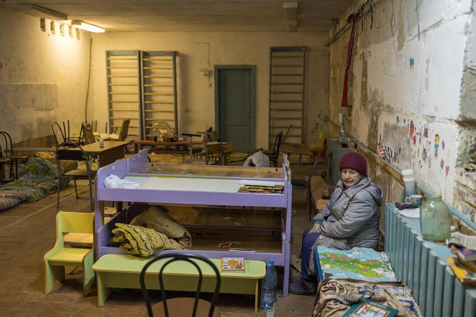 The Wider Image: Ukrainian villagers count dead after weeks confined in school basement