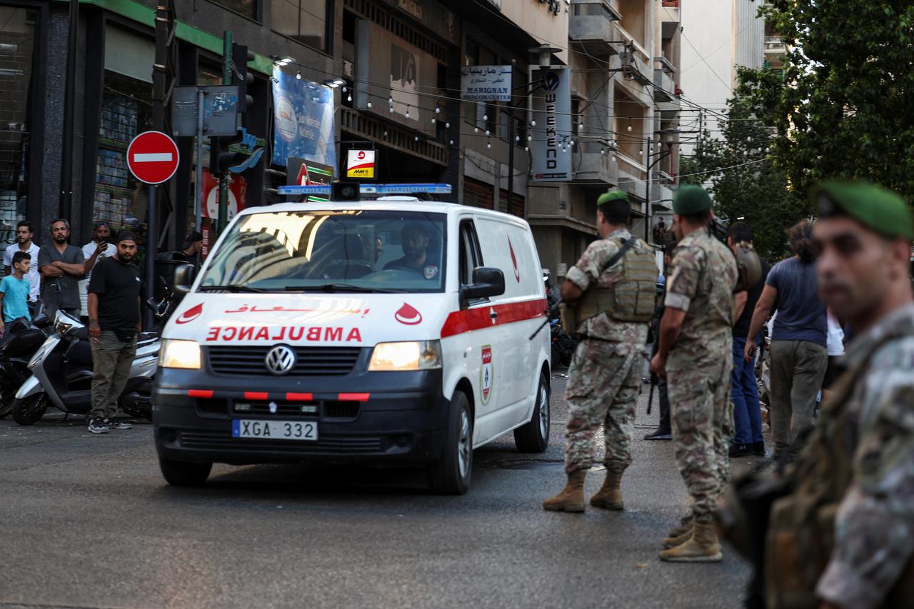 People gather outside a hospital, as more than 1,000 people, including Hezbollah fighters and medics, were wounded on Tuesday when the pagers they use to communicate exploded across Lebanon, according to a security source, in Beirut