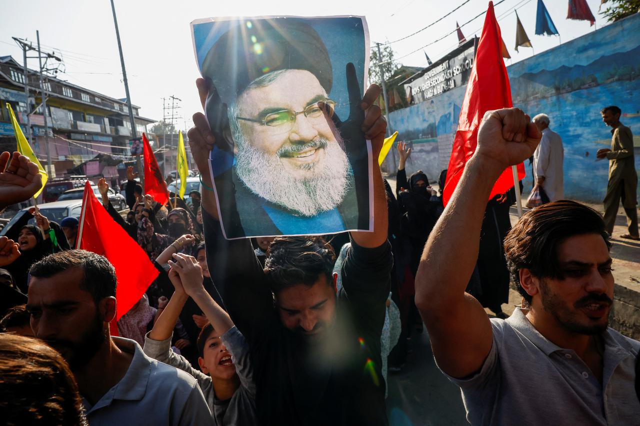 Kashmiri Shia Muslims shout slogans during a protest against Israel following the killing of Lebanon's Hezbollah leader Sayyed Hassan Nasrallah in an Israeli air strike in Beirut, on the outskirts of Srinagar