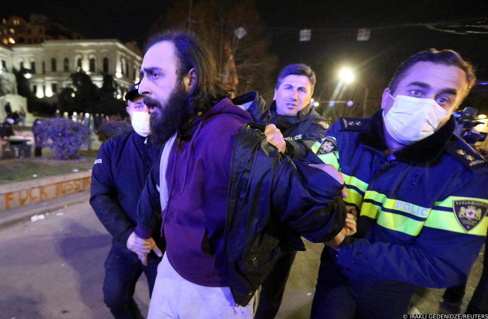 Law enforcement officers detain a man during a rally against the "foreign agents" law in Tbilisi, Georgia, March 8, 2023. REUTERS/Irakli Gedenidze Photo: IRAKLI GEDENIDZE/REUTERS