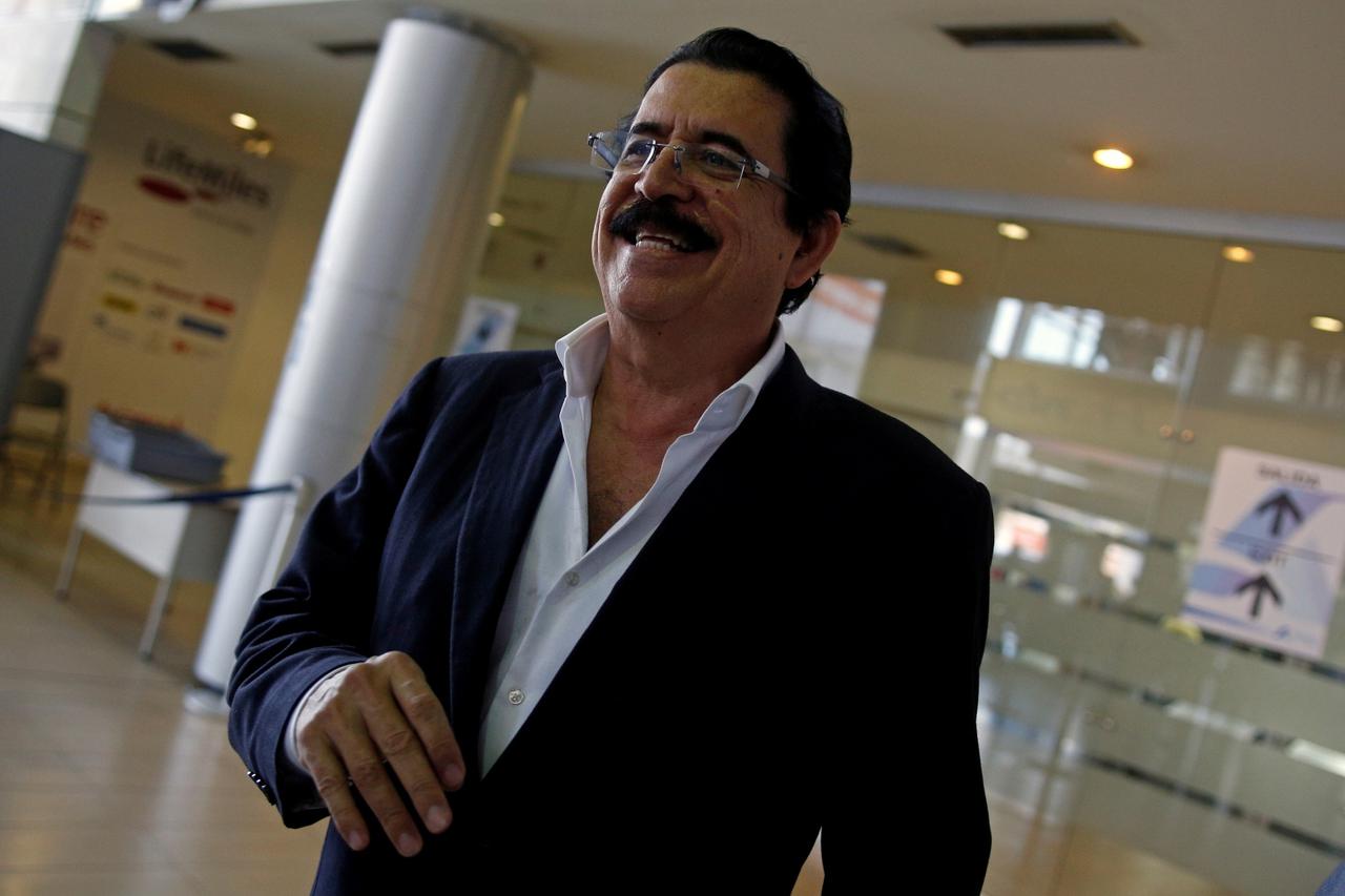 FILE PHOTO: Former Honduran President Manuel Zelaya smiles upon his arrival at Toncontin International Airport in Tegucigalpa