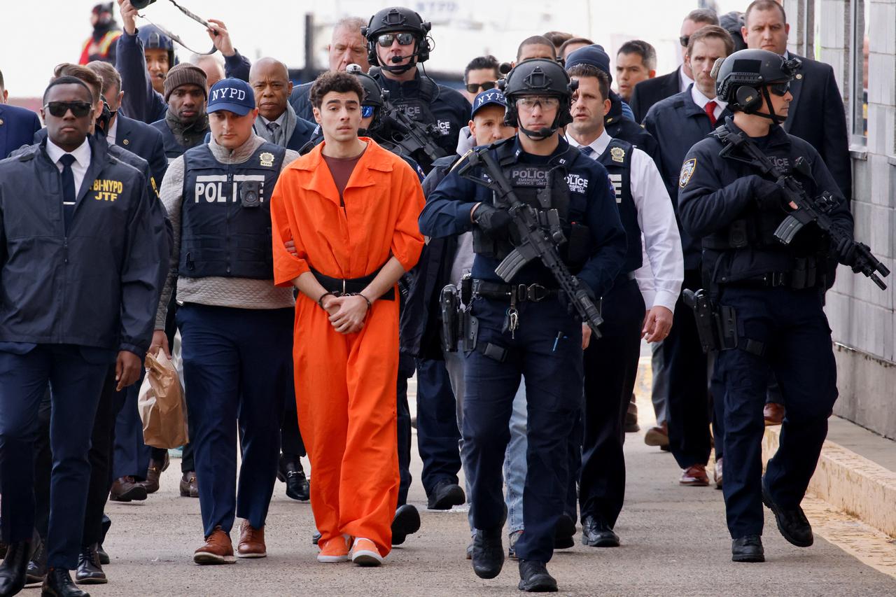 Luigi Mangione arrives at a helicopter pad after being extradited from Pennsylvania, in New York