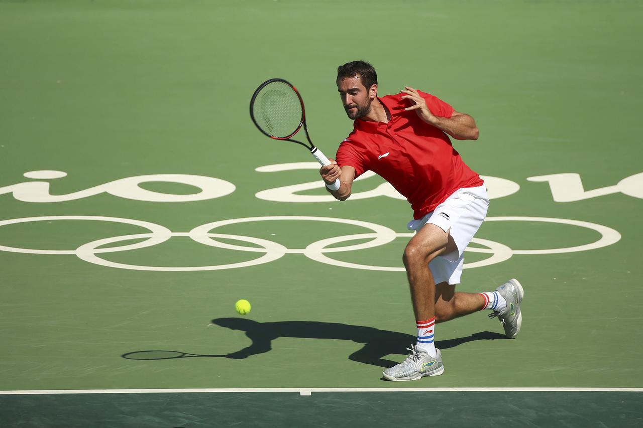 2016 Rio Olympics - Tennis - Preliminary - Men's Singles First Round - Olympic Tennis Centre - Rio de Janeiro, Brazil - 06/08/2016.  Marin Cilic (CRO) of Croatia in action against Grigor Dimitrov (BUL) of Bulgaria. REUTERS/Kevin Lamarque  FOR EDITORIAL US