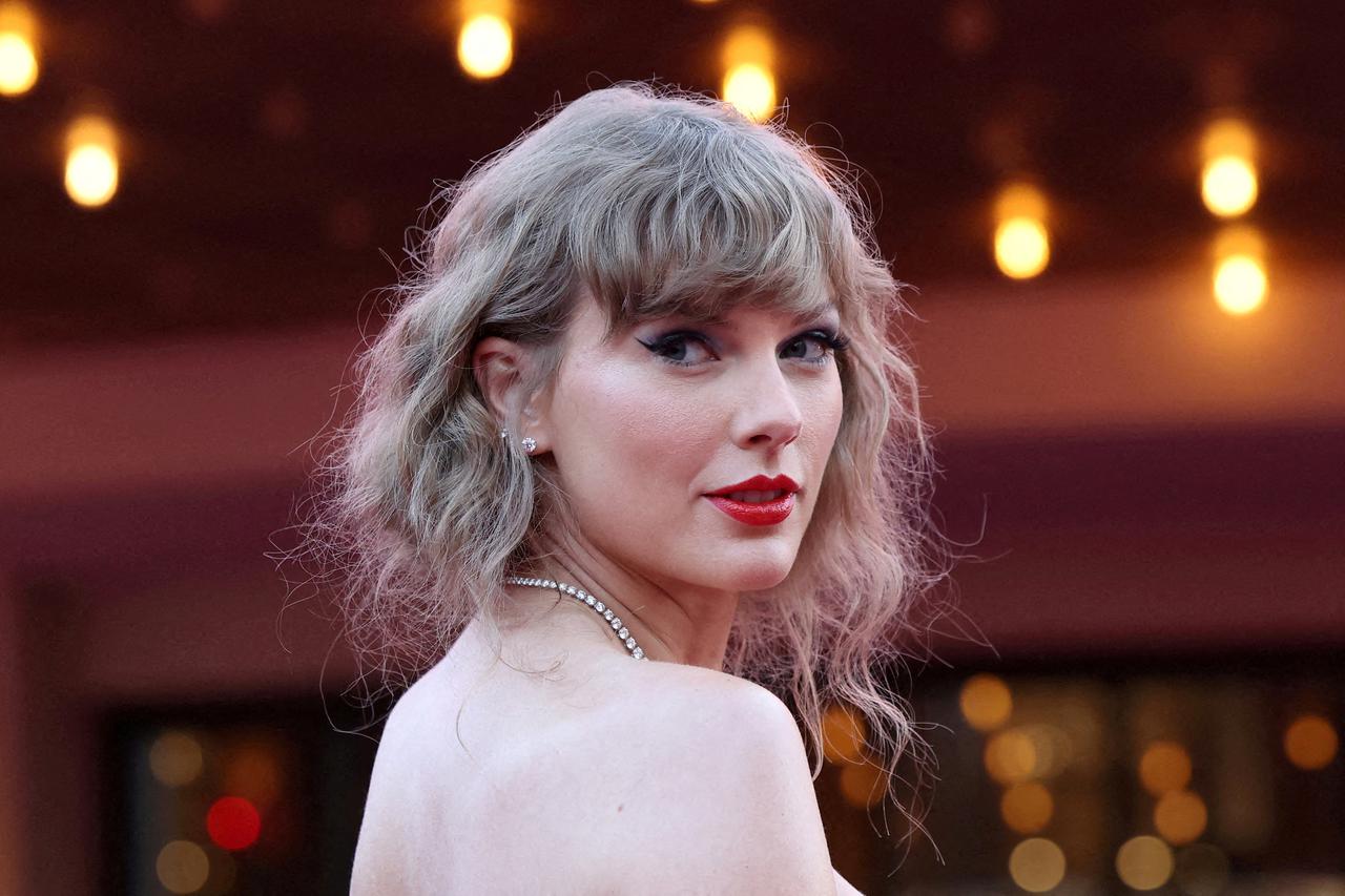 FILE PHOTO: Taylor Swift attends a premiere for Taylor Swift: The Eras Tour in Los Angeles