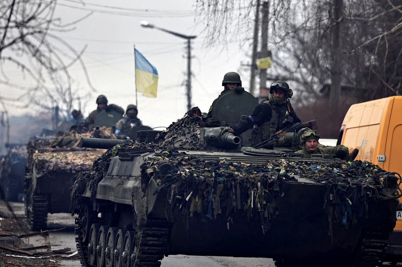 FILE PHOTO: FILE PHOTO: Ukrainian soldiers are pictured in their tanks, amid Russia's invasion on Ukraine, in Bucha, in Kyiv region