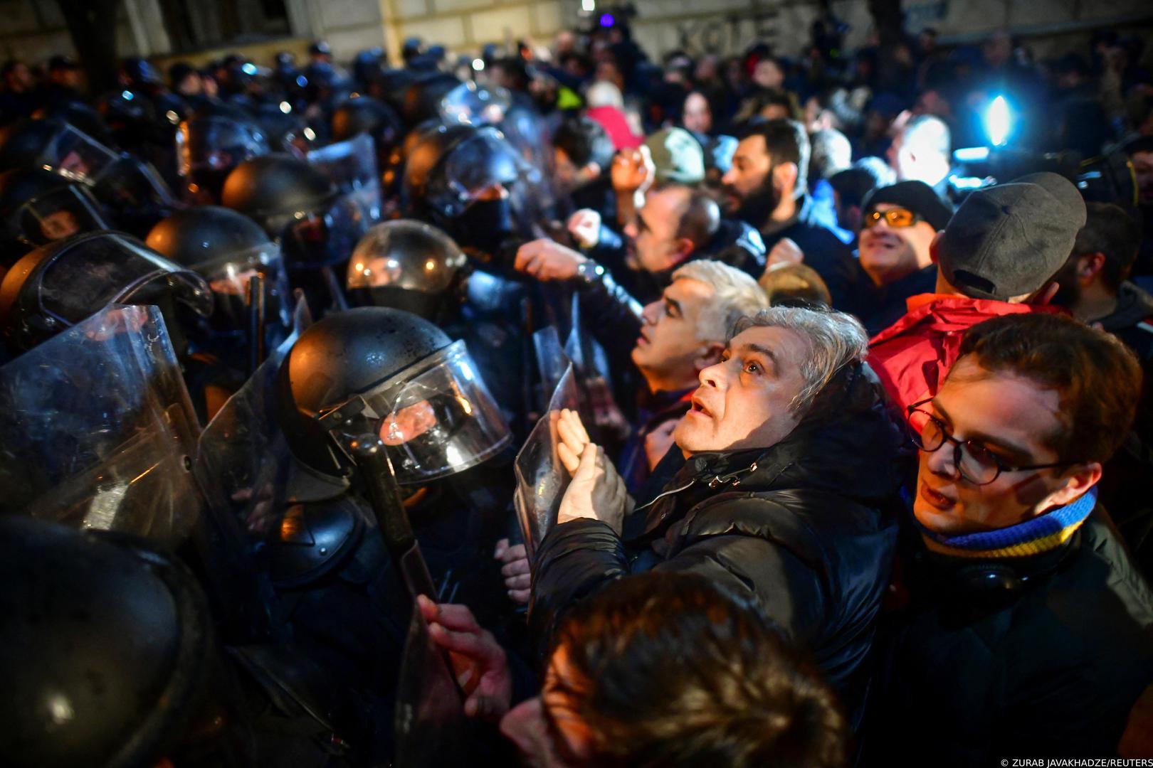 Protesters gather in front of police officers, who block the way during a rally against the "foreign agents" law in Tbilisi, Georgia, March 7, 2023. REUTERS/Zurab Javakhadze Photo: ZURAB JAVAKHADZE/REUTERS