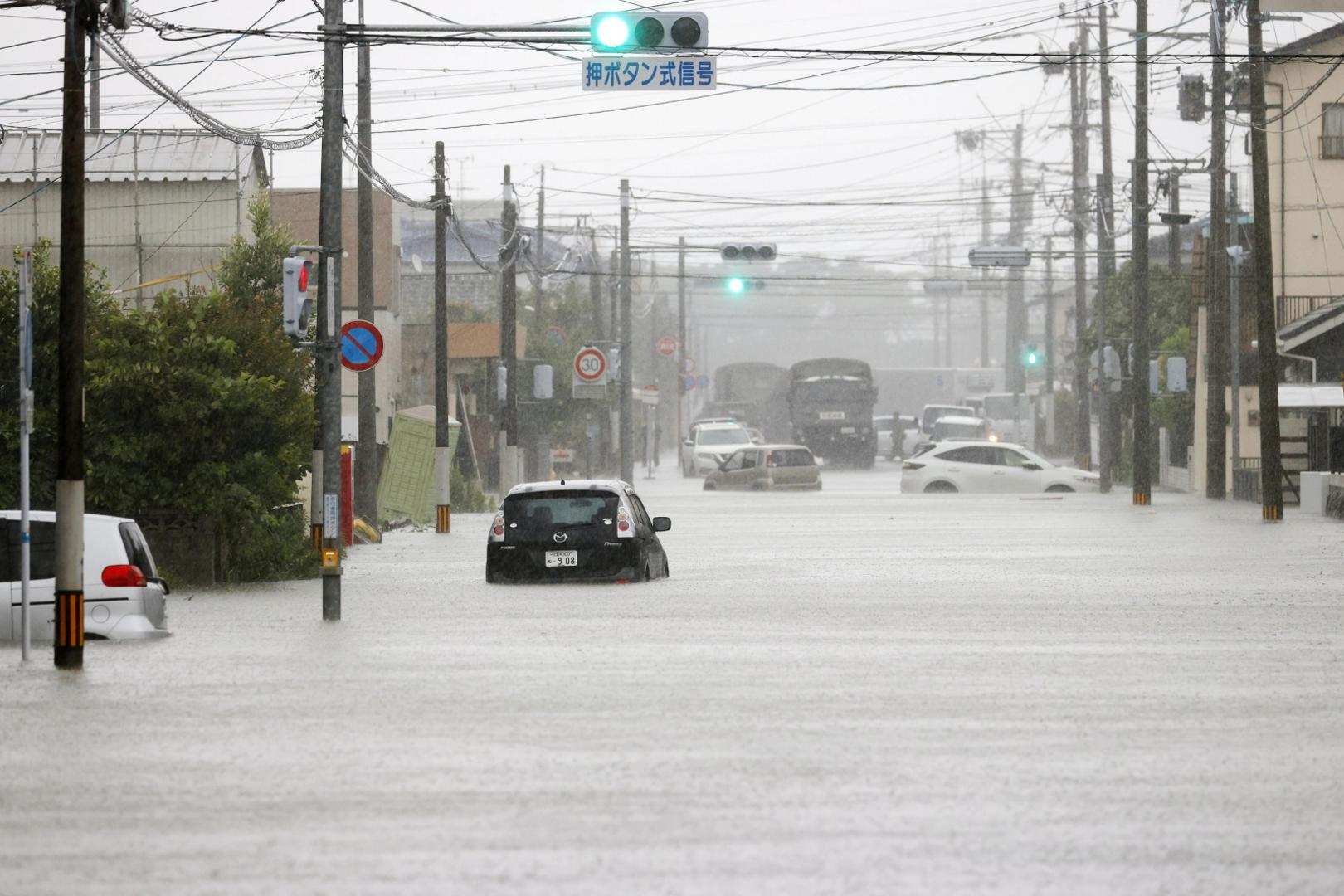 Cars are partially submerged on a road in Omuta in Fukuoka Prefecture on July 7, 2020, as torrential rain continues to hit Japan's southwestern region of Kyushu. (Kyodo)
==Kyodo
 Photo via Newscom Newscom/PIXSELL