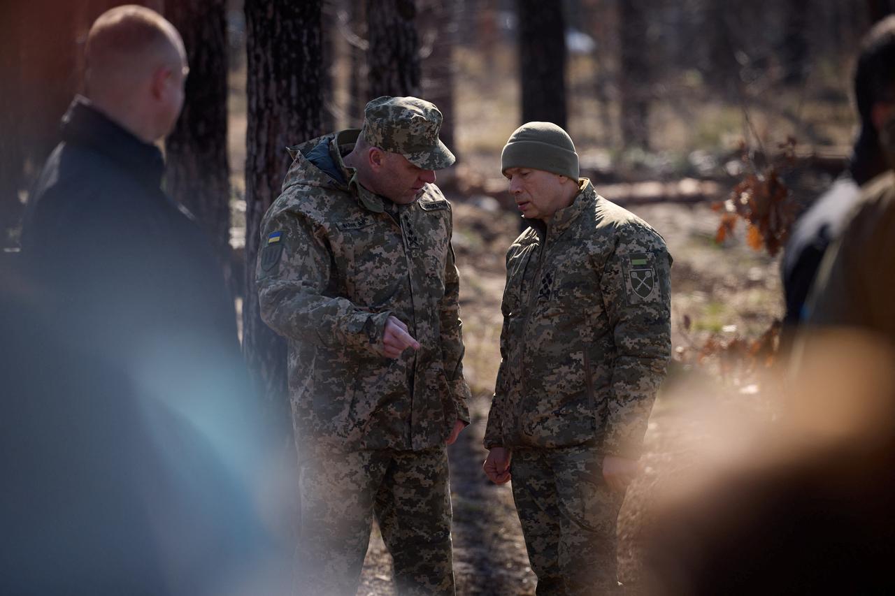 Ukrainian top military officials pay tribute to Ukrainian servicemen killed in battle for the Moshchun village, in Kyiv region