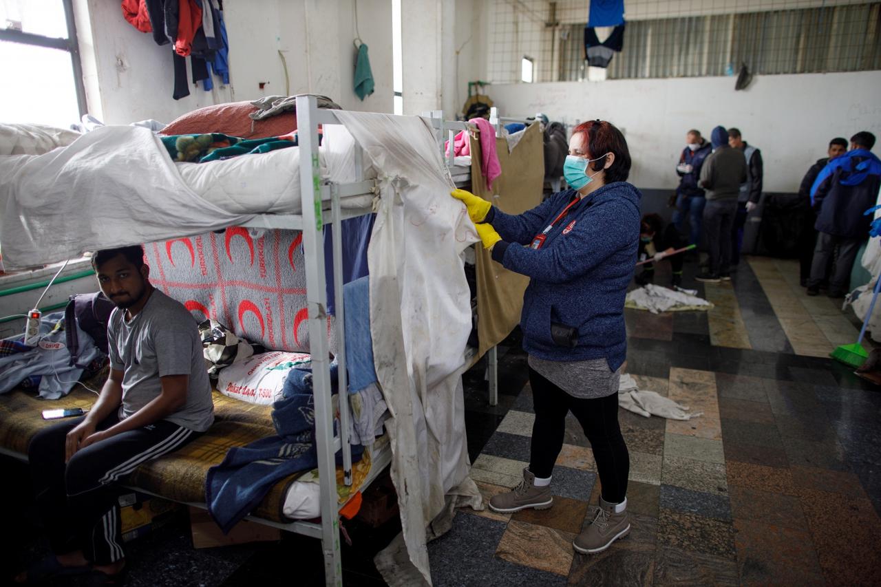 A woman is seen cleaning in refugee camp Miral in Velika Kladusa