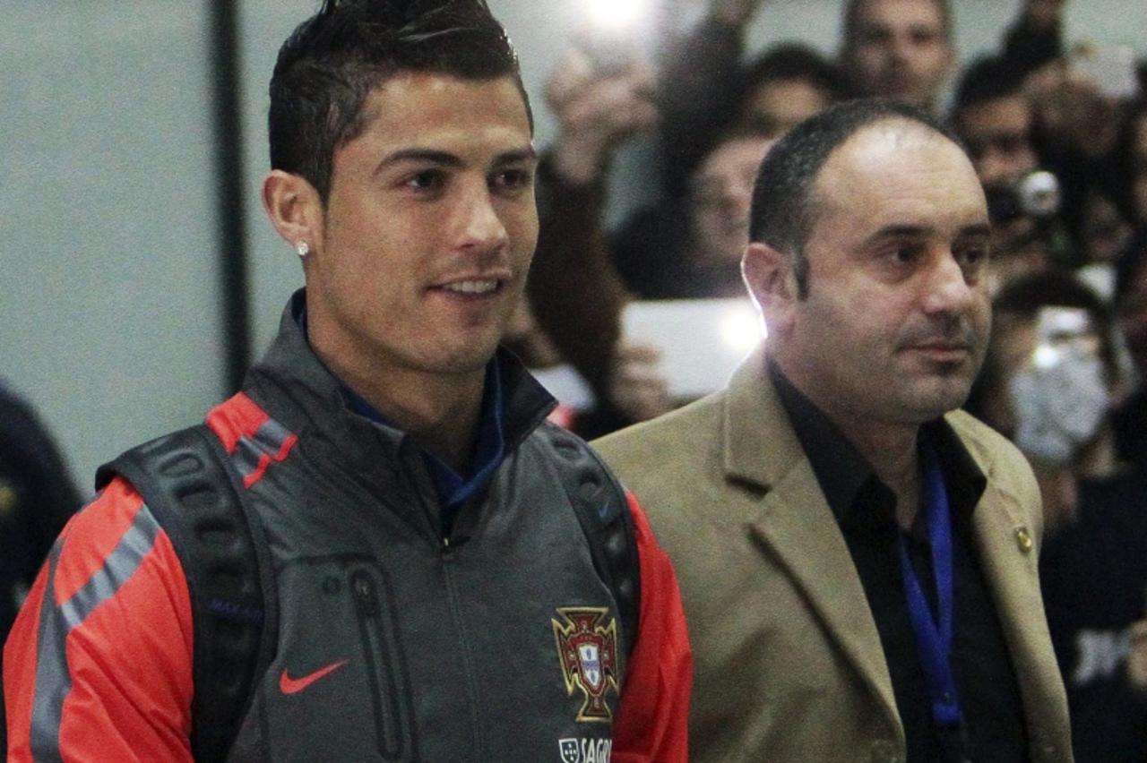 \'Portugal\'s national team player Cristiano Ronaldo leaves the airport in Sarajevo, November 9, 2011. Portugal will face Bosnia in the first leg of their Euro 2012 playoff on November 11. REUTERS/Str