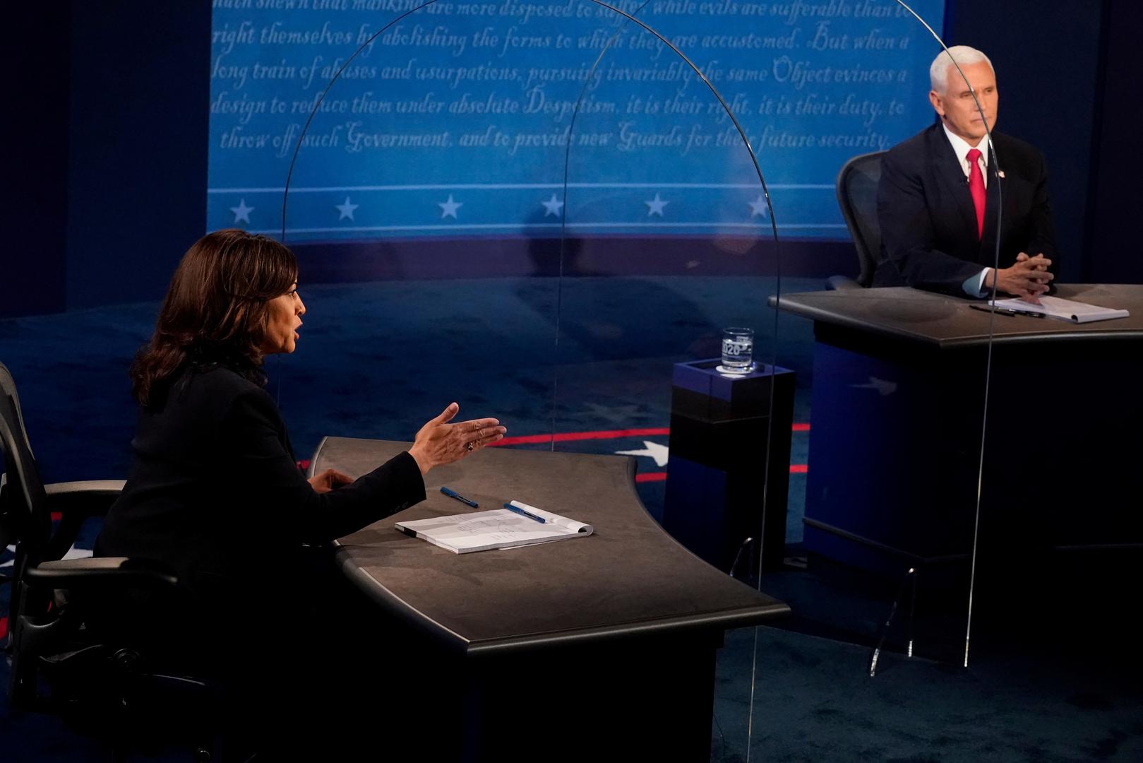 U.S. 2020 vice presidential debate Democratic vice presidential nominee and U.S. Senator Kamala Harris answers a question as U.S. Vice President Mike Pence watches, during the 2020 vice presidential debate on the campus of the University of Utah in Salt Lake City, Utah, U.S., October 7, 2020.  Morry Gash/Pool via REUTERS POOL