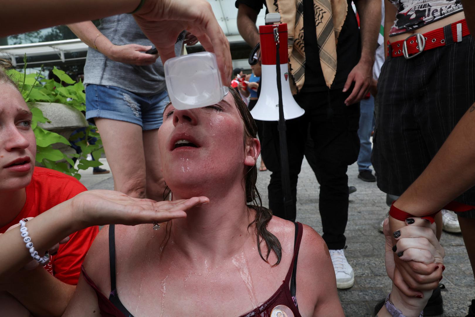 A pro-Palestinian demonstrator gets her eyes washed after U.S. Capitol Police used pepper spray on protesters, on the day Israeli Prime Minister Benjamin Netanyahu addresses a joint meeting of Congress, on Capitol Hill, in Washington, U.S., July 24, 2024. REUTERS/Umit Bektas Photo: UMIT BEKTAS/REUTERS