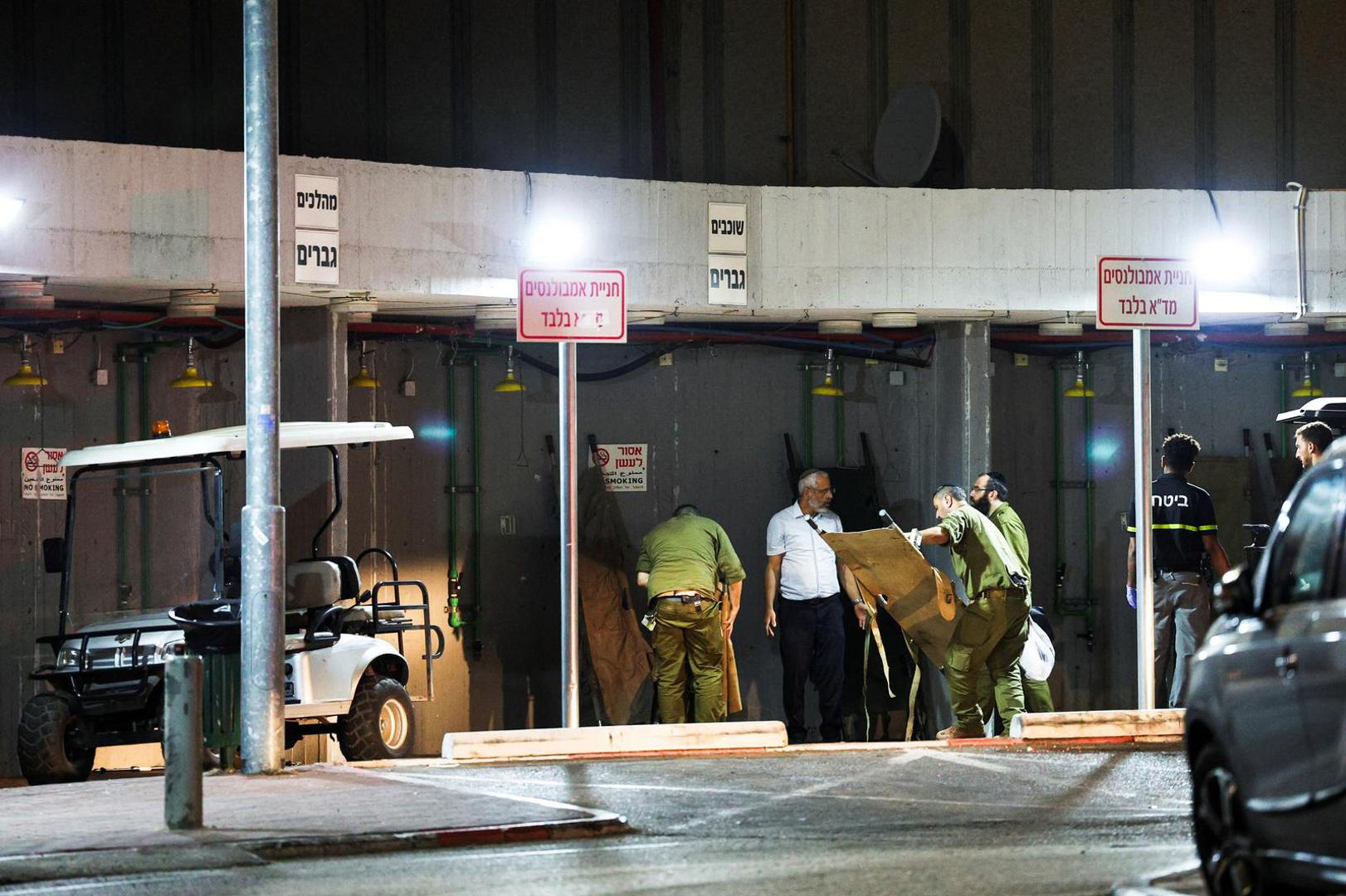 Israeli soldiers and a man fold gurneys following a drone attack from Lebanon, amid cross-border hostilities between Hezbollah and Israel, at Sheba Medical Centre in Ramat Gan, Israel October 13, 2024. REUTERS/Violeta Santos Moura Photo: VIOLETA SANTOS MOURA/REUTERS