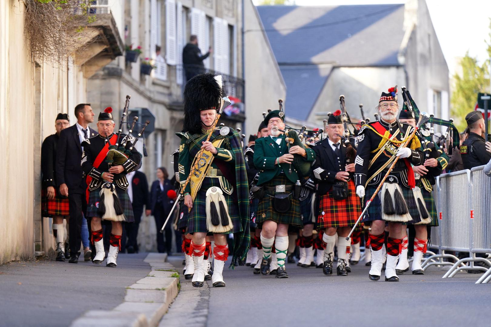 International pipers from France, Germany and the United Kingdom during a procession from Bayeux Cathedral to the Great Vigil at the Commonwealth War Grave Commission's  Bayeux War Cemetery in Normandy, France, to commemorate the 80th anniversary of D-Day. June 5, 2024. Aaron Chown/Pool via REUTERS Photo: Aaron Chown/REUTERS