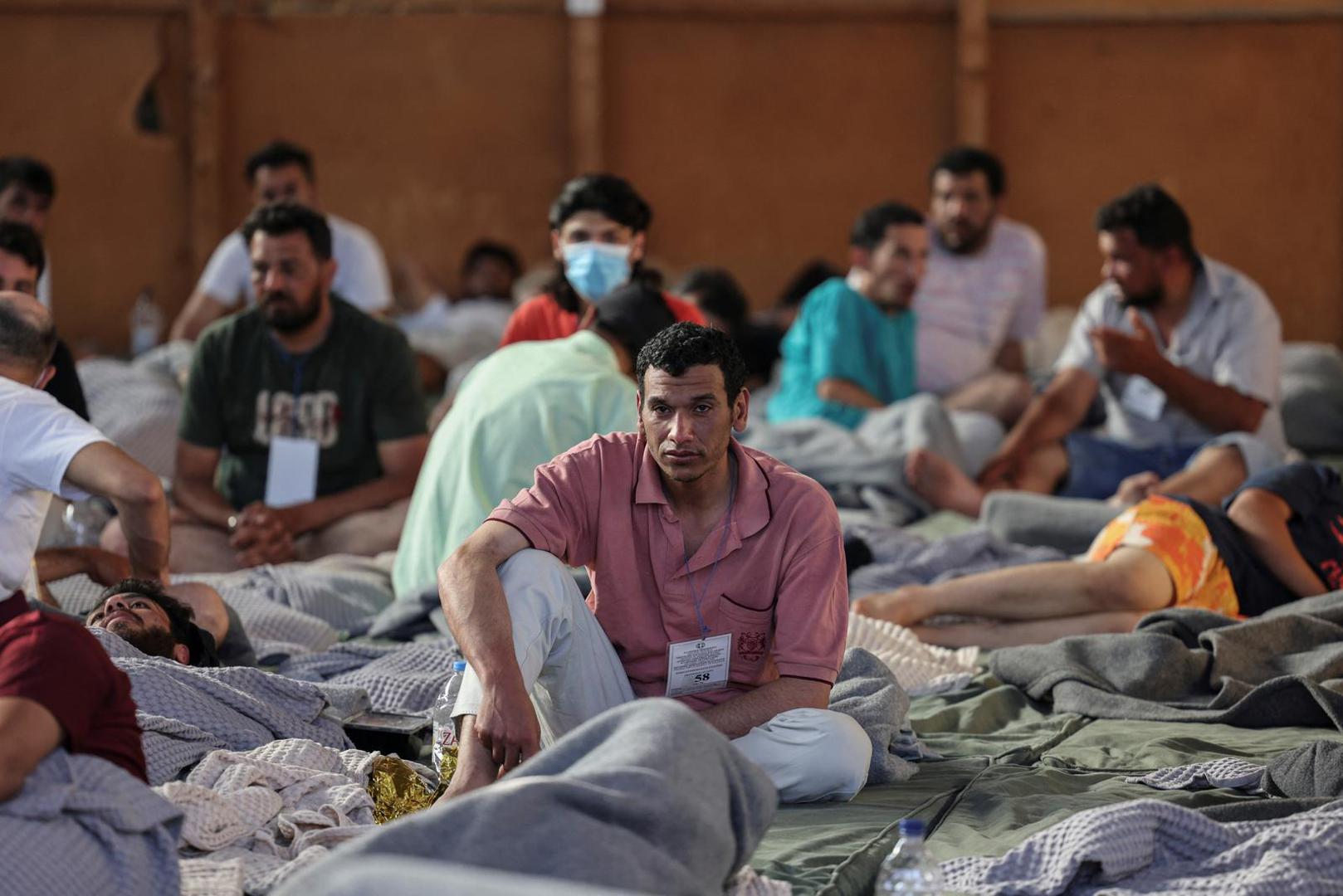 Migrants rest in a shelter, following a rescue operation, after their boat capsized in the open sea,  in Kalamata, Greece, June 14, 2023. REUTERS/Stelios Misinas Photo: STELIOS MISINAS/REUTERS