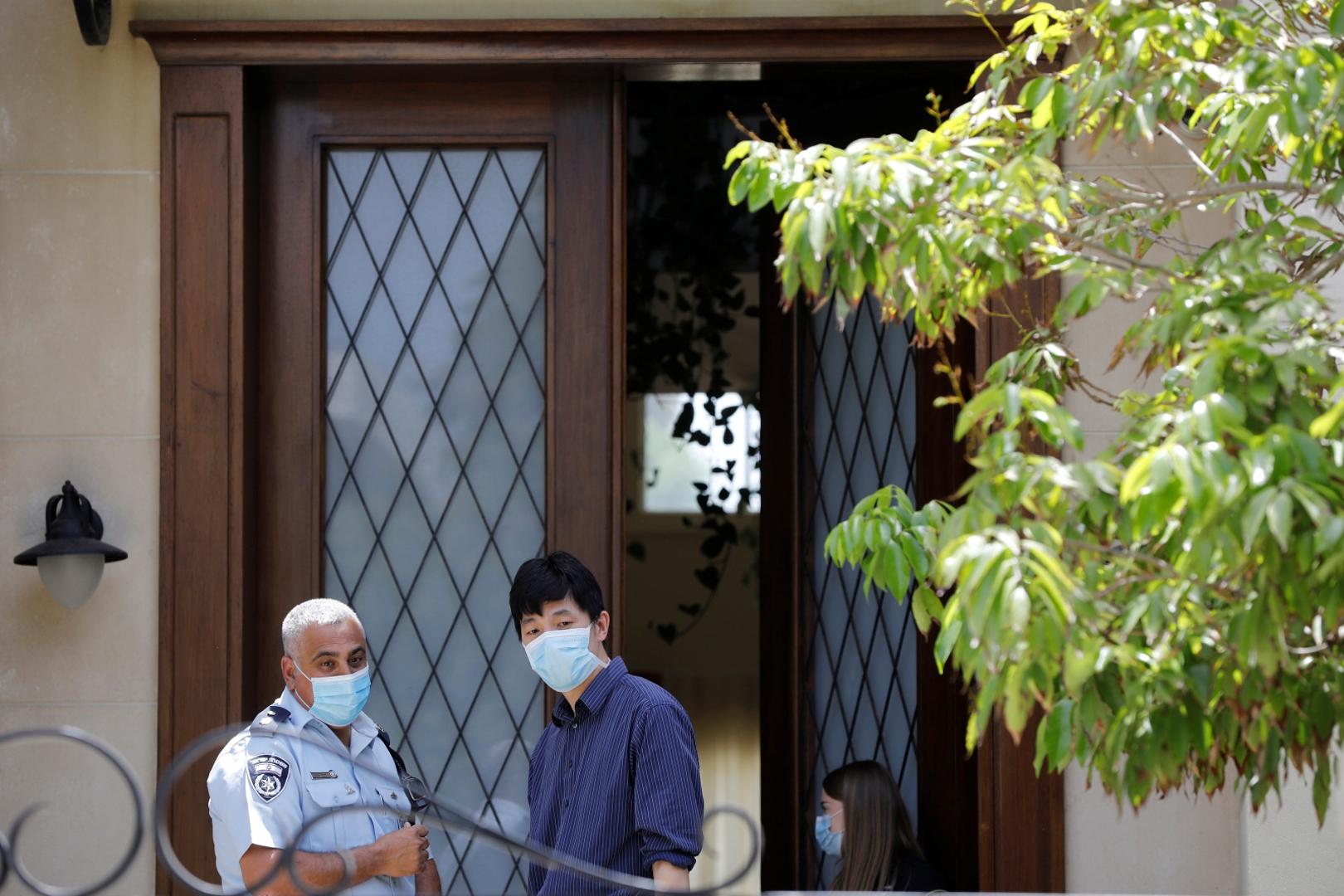 An Israeli policeman and a man stand near the entrance of China's ambassador to Israel, Du Wei's house, in Herzliya, near Tel Aviv, Israel An Israeli policeman and a man stand near the entrance of China's ambassador to Israel, Du Wei's house, in Herzliya, near Tel Aviv, Israel May 17, 2020. REUTERS/Nir Elias NIR ELIAS