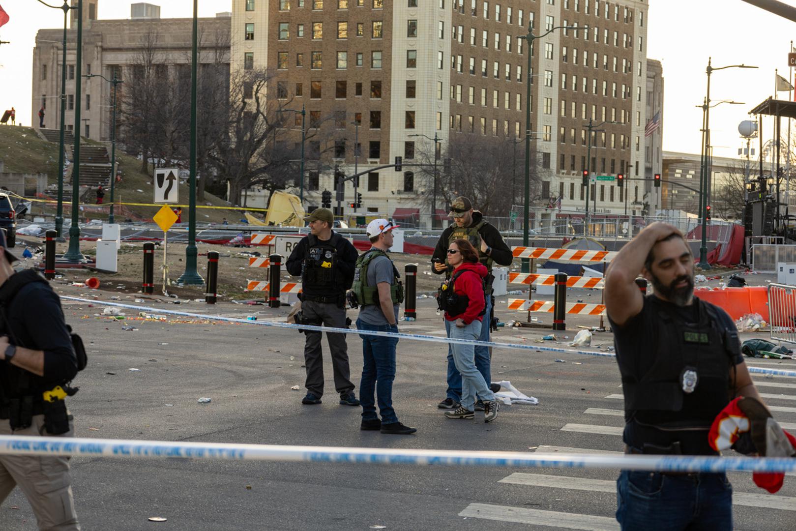 (240215) -- KANSAS CITY, Feb. 15, 2024 (Xinhua) -- Policemen work at the site following a shooting in Kansas City, Missouri, the United States, Feb. 14, 2024. At least one person was killed and 22 were injured as gunfire erupted during the Kansas City Chiefs' Super Bowl victory parade in Kansas City, U.S. state of Missouri, Stacey Graves, chief of the Kansas City Missouri Police Department, said at a news conference on Wednesday afternoon. (Photo by Robert Reed/Xinhua) Photo: Robert Reed/XINHUA