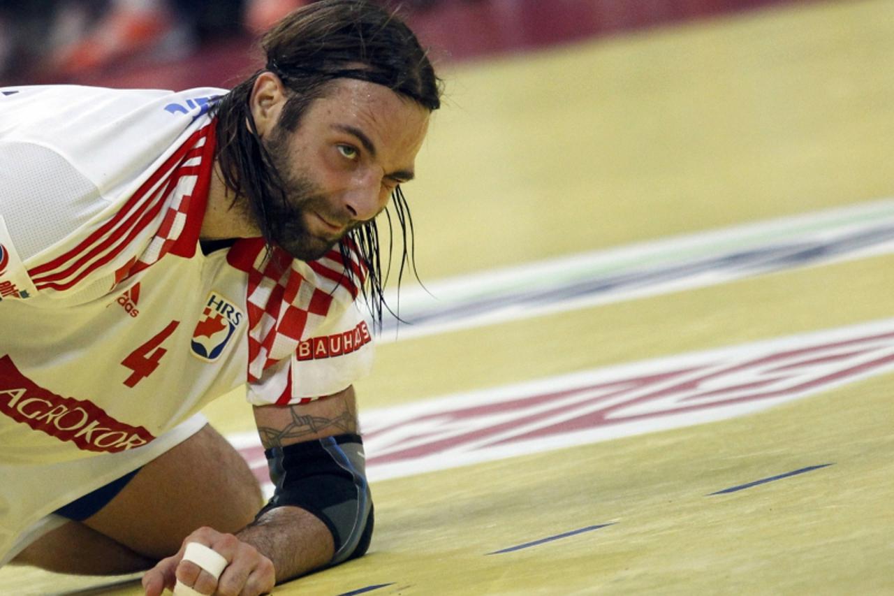 'Croatia\'s Ivano Balic reacts during their men\'s European Handball Championship semifinals match against Serbia in Belgrade January 27, 2012. REUTERS/Stoyan Nenov (SERBIA  - Tags: SPORT HANDBALL)'