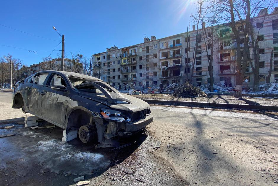 View shows a damaged residential building in Kharkiv