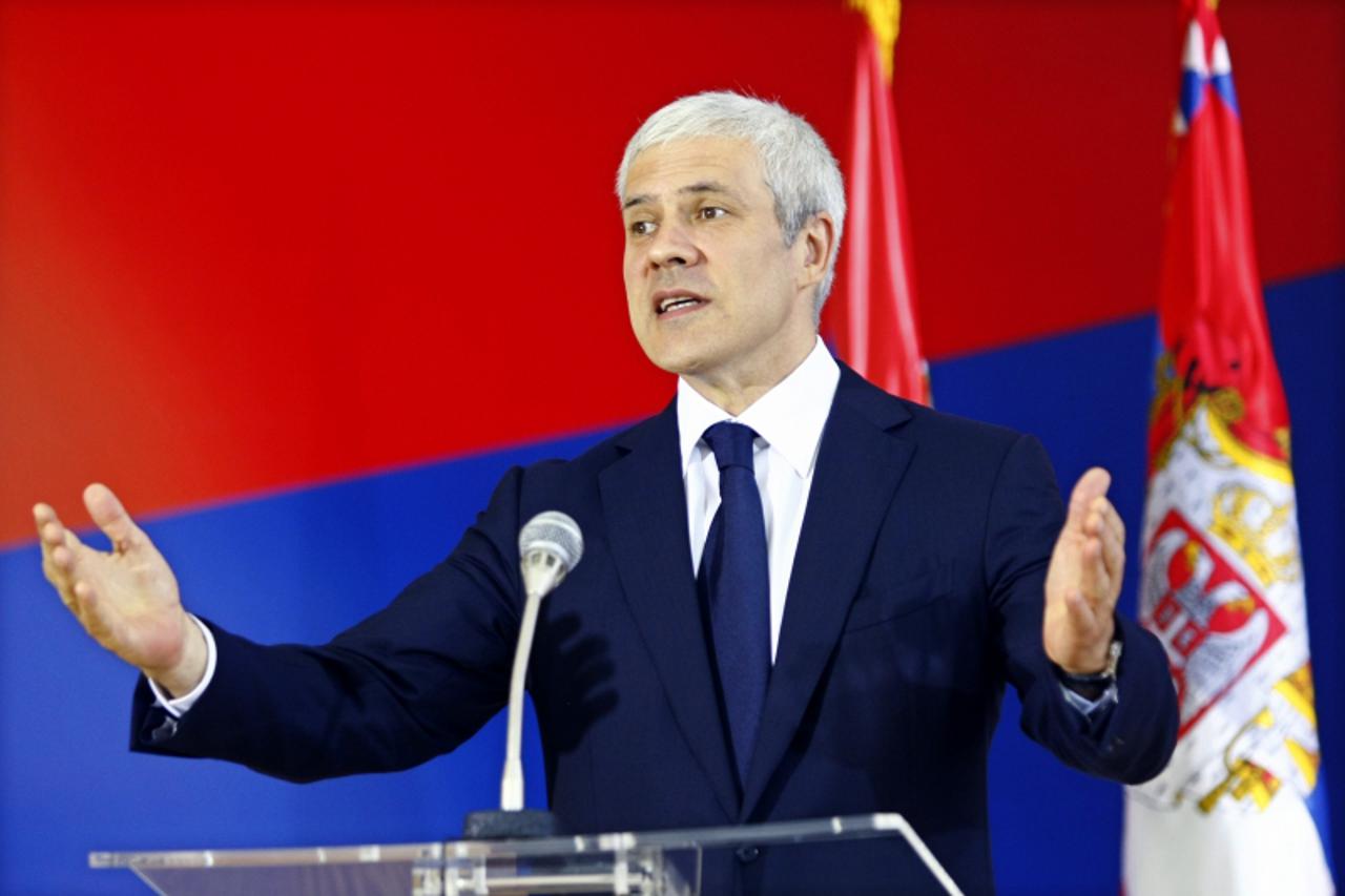 'Serbia\'s President Boris Tadic gestures during an urgent media conference in Belgrade July 20, 2011. President Tadic confirmed that Goran Hadzic, Serbia\'s last major war crimes fugitive, a Croatian