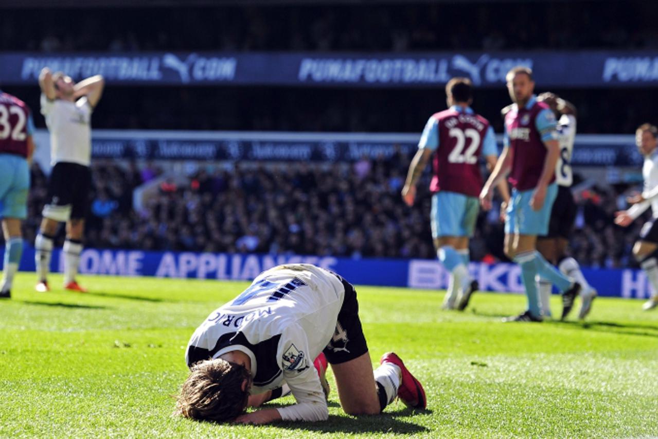 'Tottenham Hotspur\'s Croatian midfielder Luka Modric rues a missed chance during the English Premier League football match between Tottenham Hotspur and West Ham United at White Hart Lane in north Lo