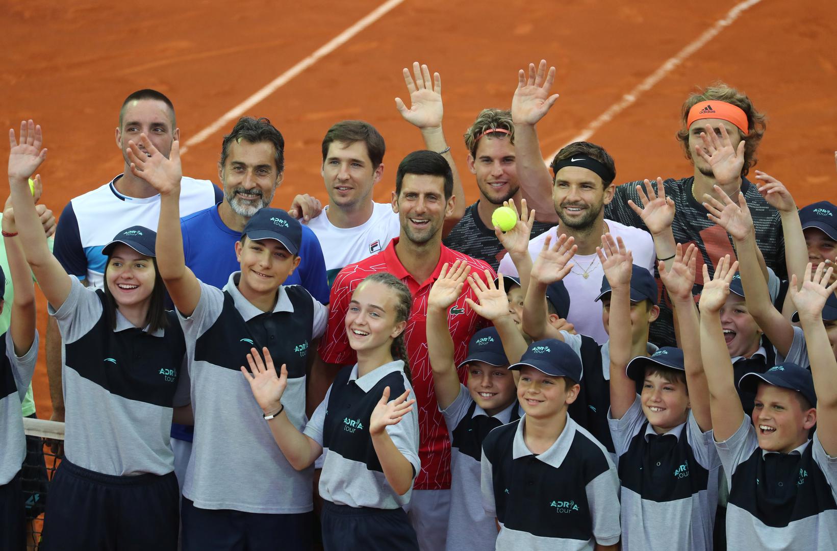 Adria Tour Tennis - Adria Tour - Novak Tennis Centre, Belgrade, Serbia - June 12, 2020   Serbia's Viktor Troicki, Nenad Zimonjic, Dusan Lajovic, Novak Djokovic, Austria's Dominic Thiem, Bulgaria's Grigor Dimitrov and Germany's Alexander Zverev pose for a photo with the ballkids, following the outbreak of the coronavirus disease (COVID-19)   REUTERS/Marko Djurica MARKO DJURICA