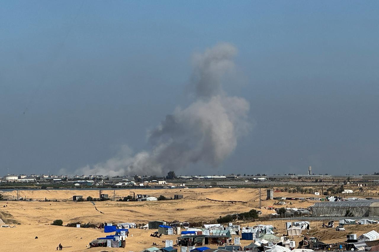 Smoke rises during an Israeli ground operation in Khan Younis, as seen from a tent camp sheltering displaced Palestinians in Rafah