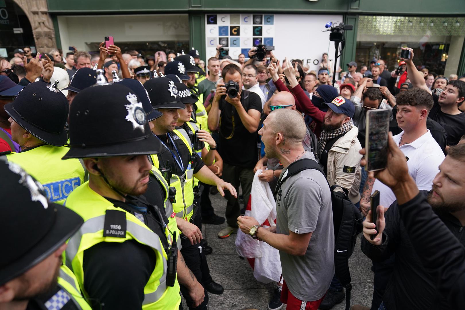 Police officers with people as they protest in Nottingham Market Square following the stabbing attacks on Monday in Southport, in which three young children were killed. Picture date: Saturday August 3, 2024. Photo: Jacob King/PRESS ASSOCIATION