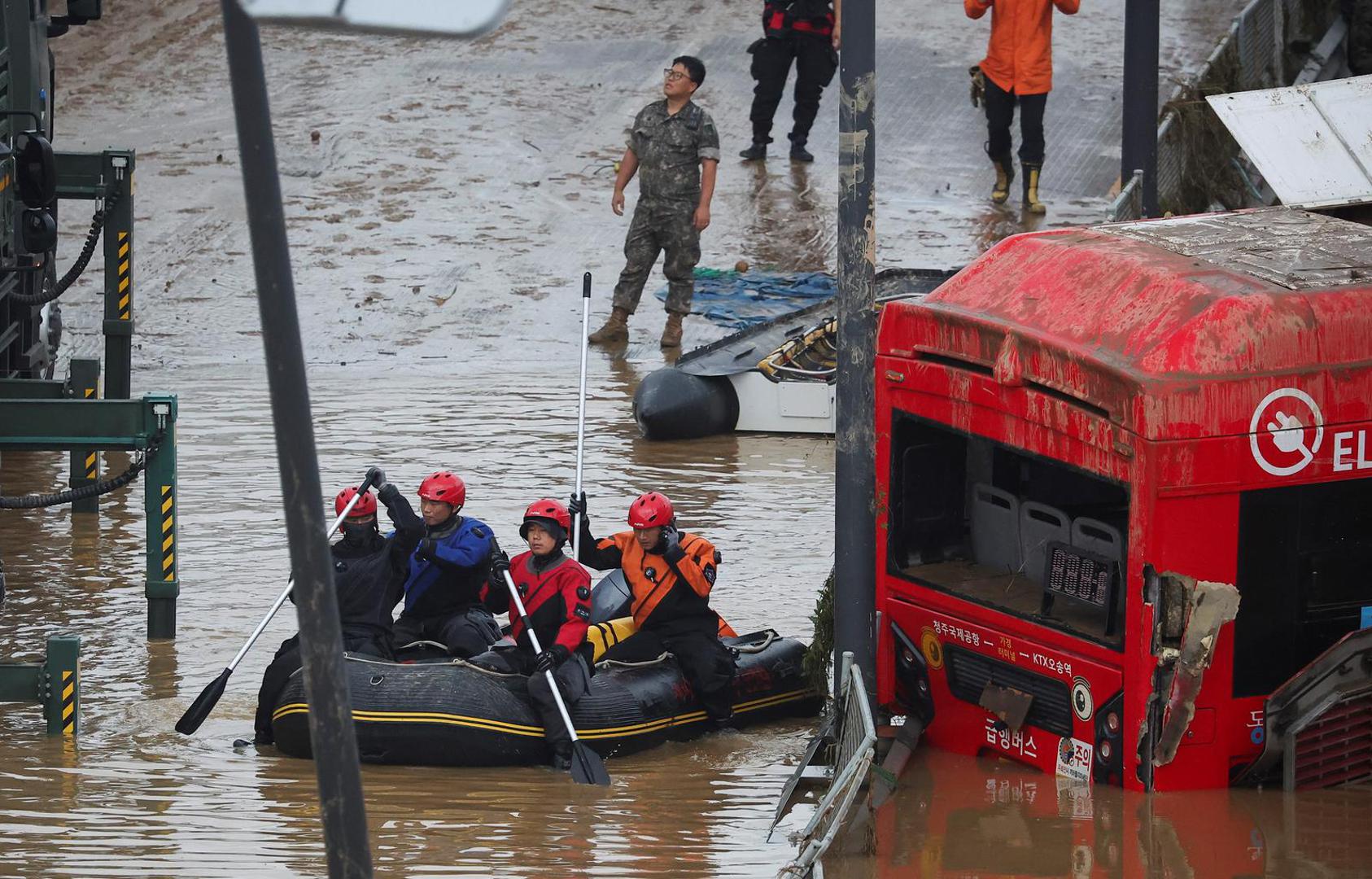 Rescue workers take part in a search and rescue operation near an underpass that has been submerged by a flooded river caused by torrential rain in Cheongju, South Korea, July 16, 2023.   REUTERS/Kim Hong-ji Photo: KIM HONG-JI/REUTERS